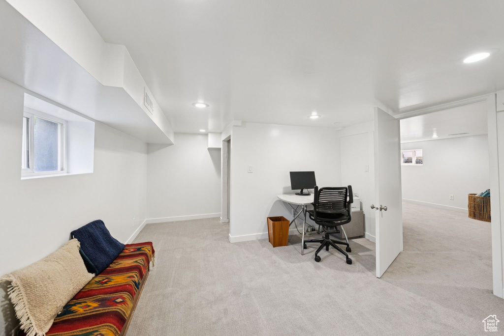 Carpeted home office with recessed lighting and baseboards