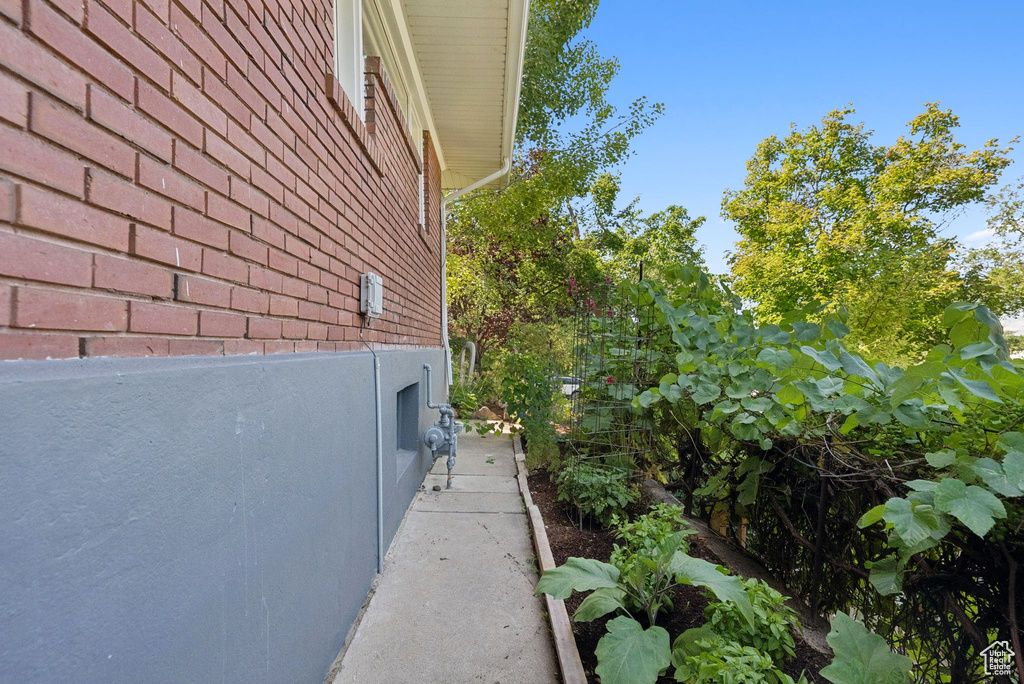 View of side of home with brick siding