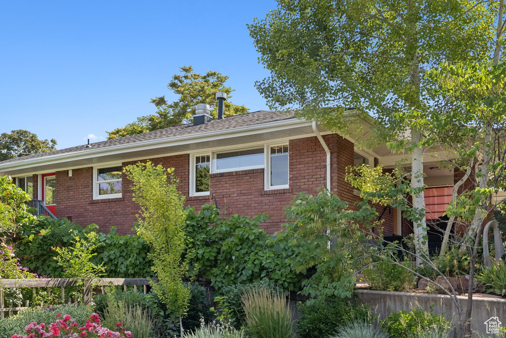 View of side of property with brick siding
