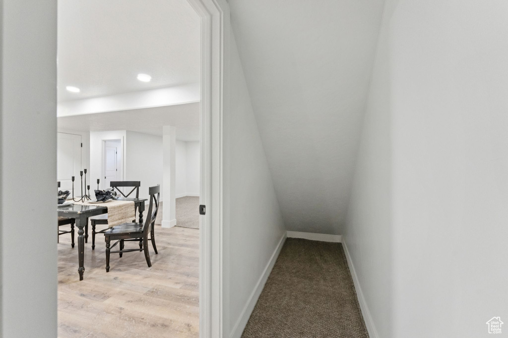 Stairway featuring recessed lighting and wood finished floors
