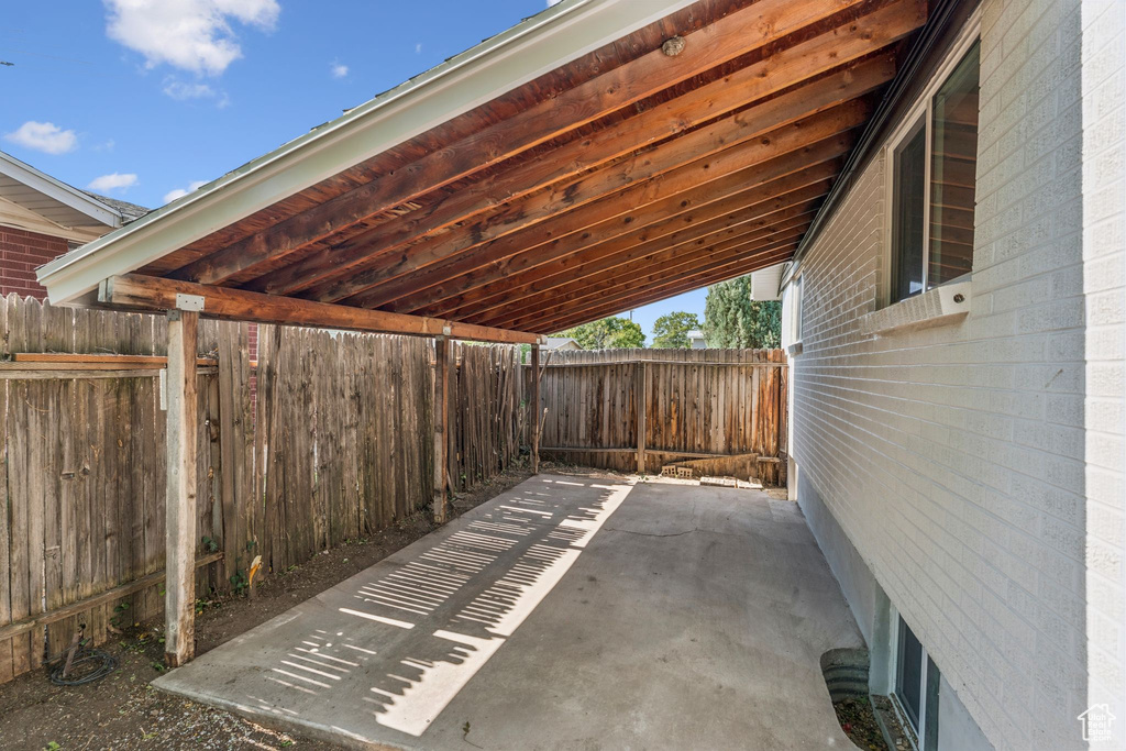 View of patio / terrace with a carport