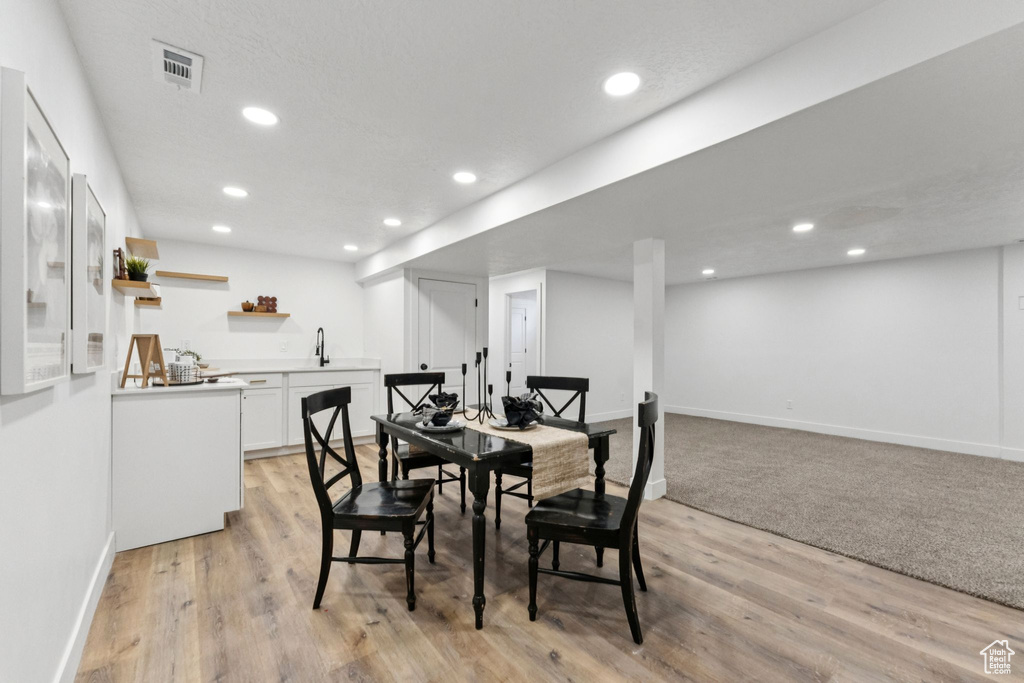 Dining room featuring recessed lighting and light wood-style flooring