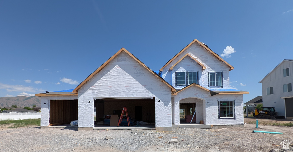 Property in mid-construction with a garage