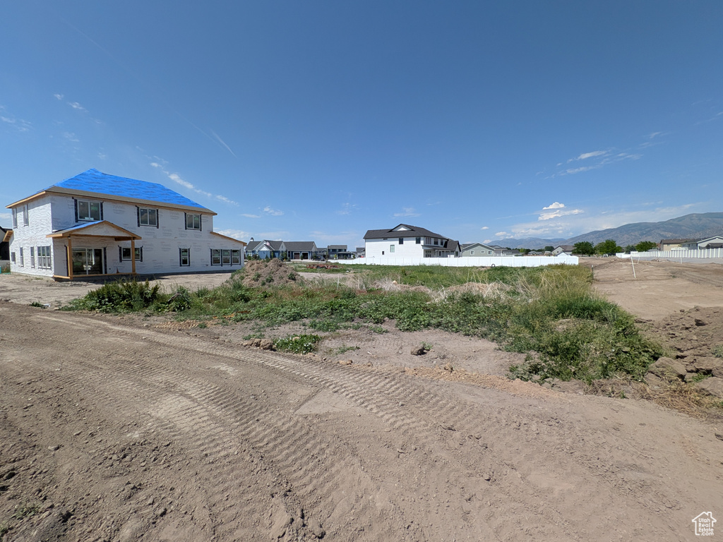 View of dirt / gravel road featuring a mountain view