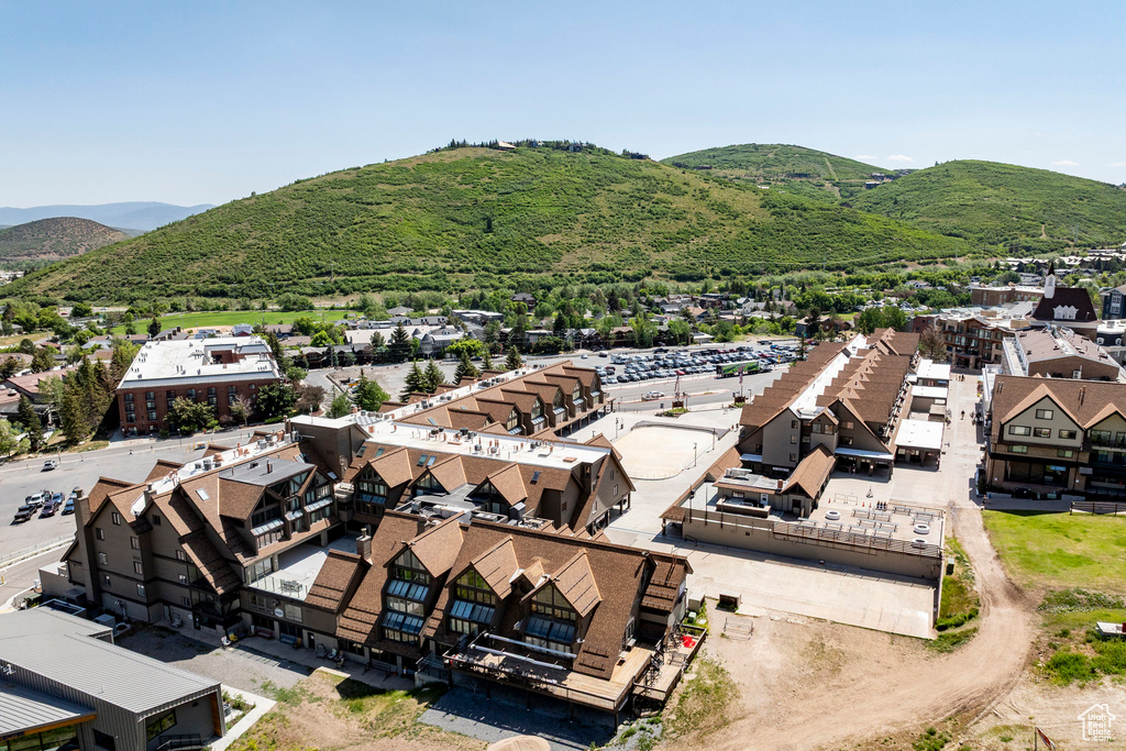 Aerial view of residential area featuring a mountain backdrop