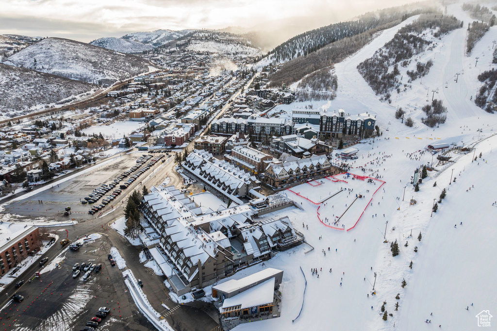 Snowy aerial view featuring a mountain view