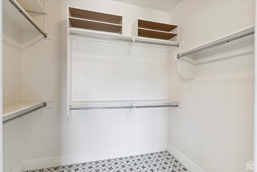 Spacious closet with light flooring