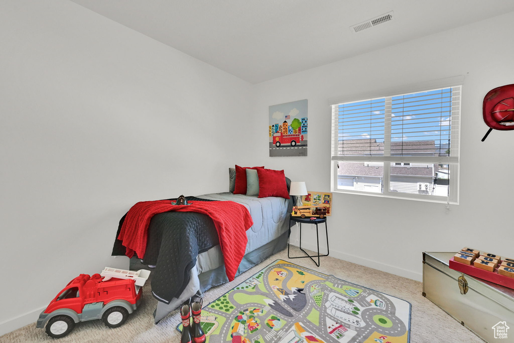 Bedroom with carpet and baseboards