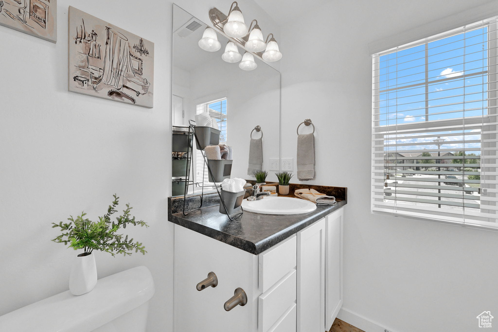 Bathroom with vanity and toilet
