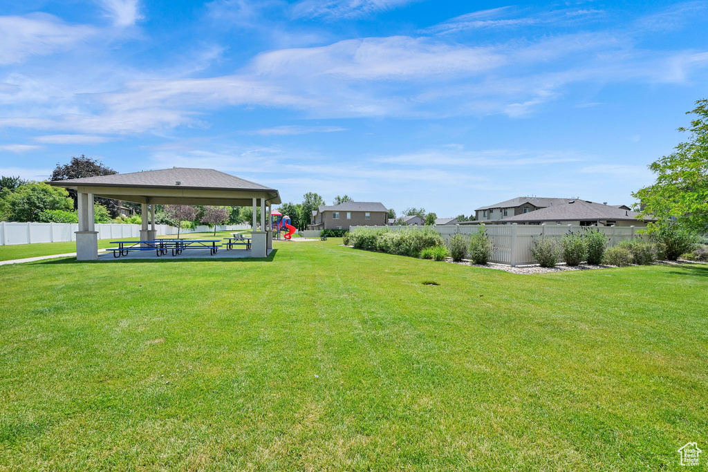 Fenced backyard with a gazebo