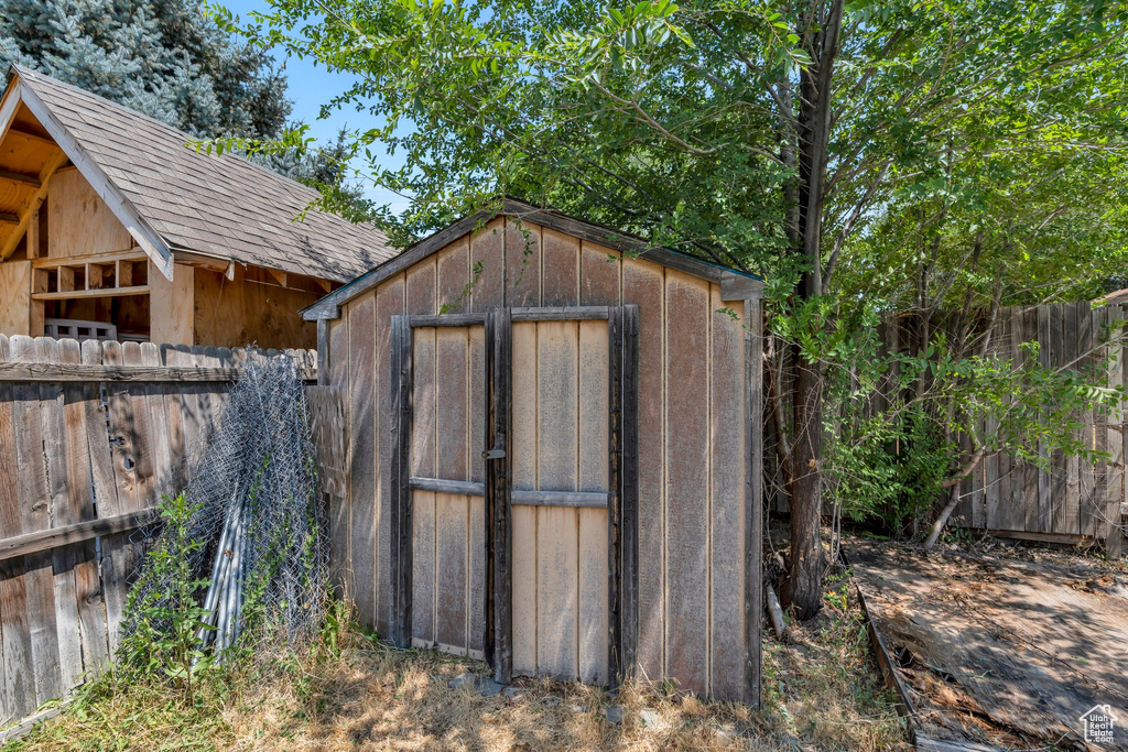 View of shed featuring a fenced backyard