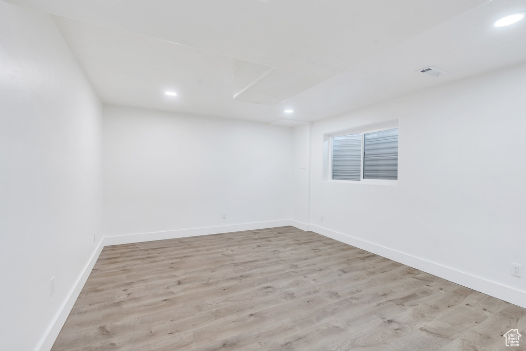 Spare room with recessed lighting and wood finished floors