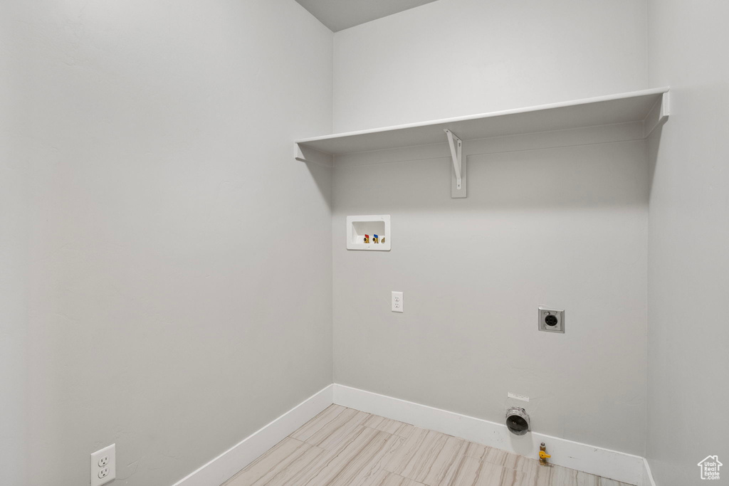 Washroom with washer hookup and electric dryer hookup