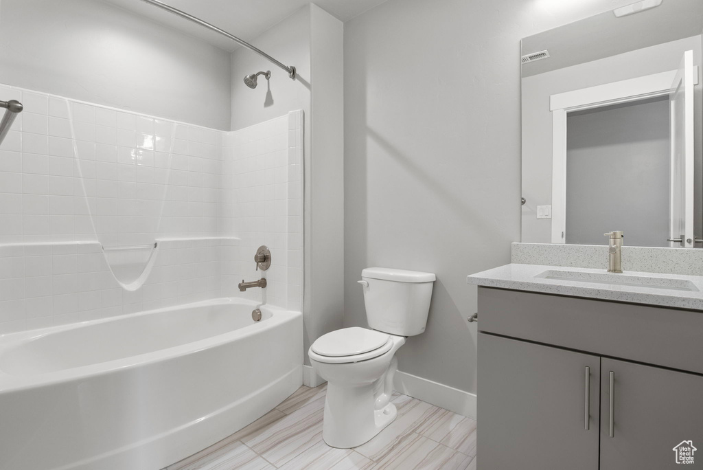 Full bath with bathing tub / shower combination and vanity