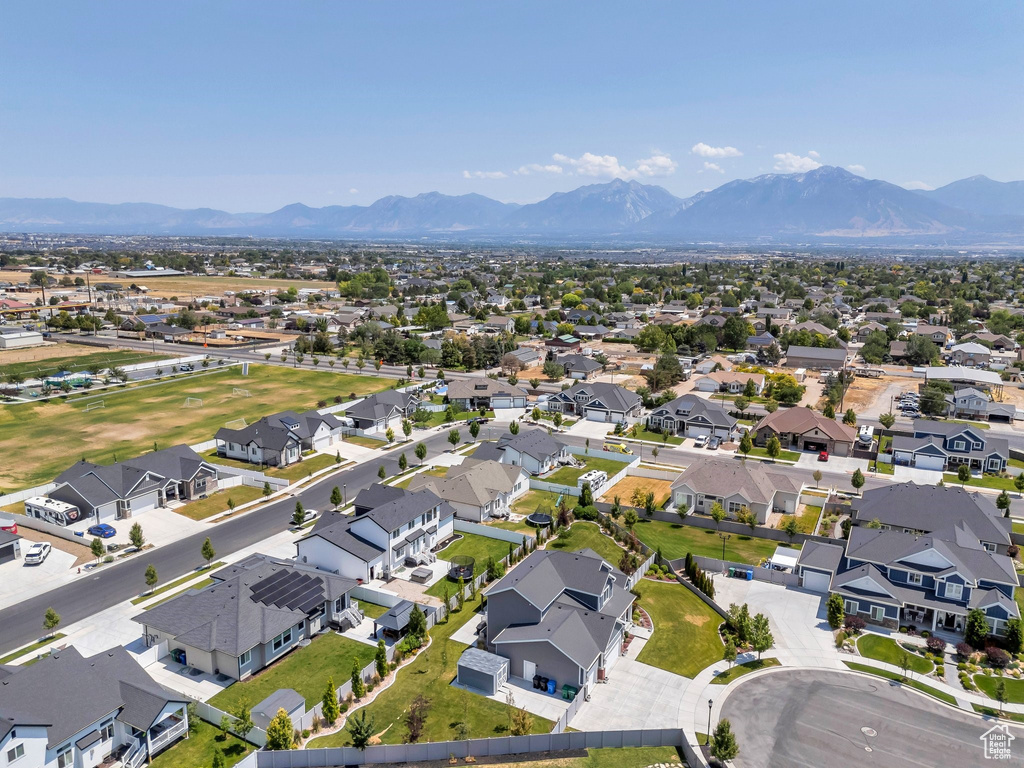 Aerial perspective of suburban area featuring a mountain backdrop
