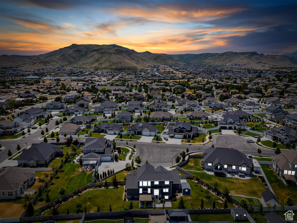 Aerial view of property\'s location with a mountainous background and nearby suburban area