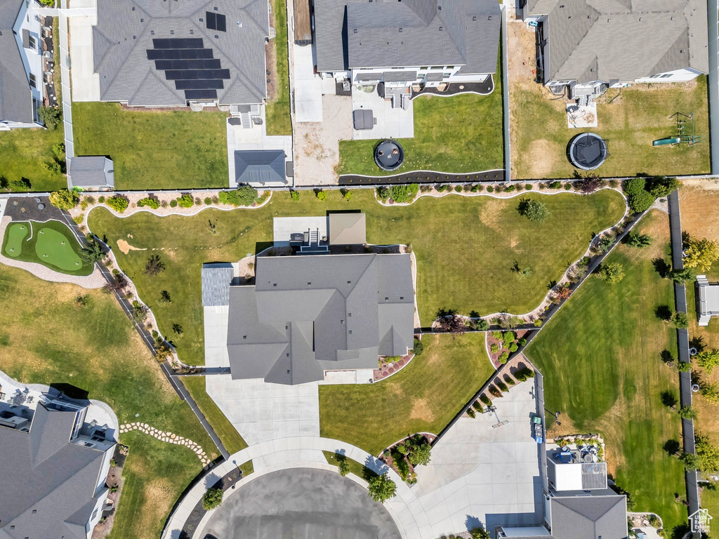 Aerial view of property and surrounding area featuring nearby suburban area