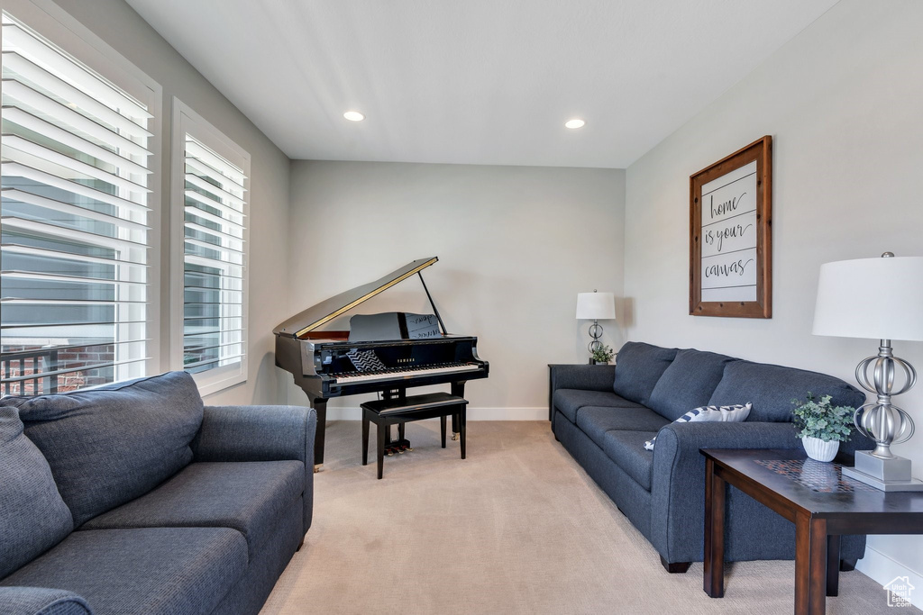 Living room featuring light carpet and recessed lighting