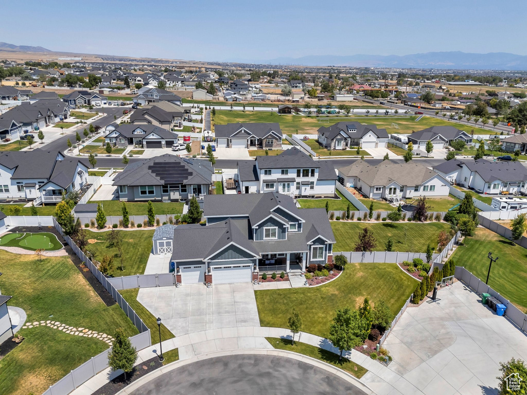 Aerial perspective of suburban area with a mountain backdrop