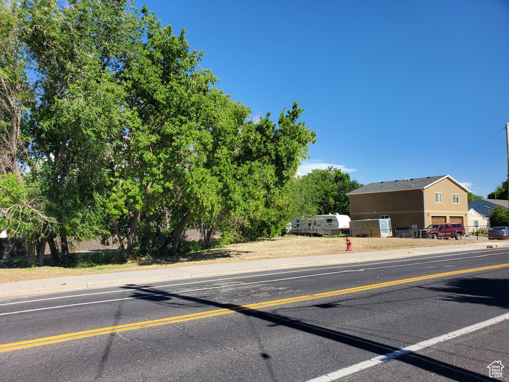 View of asphalt street with curbs