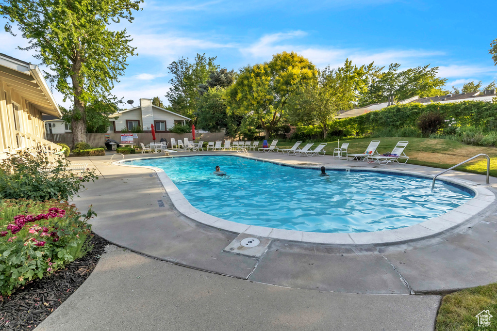 Community pool featuring a patio area