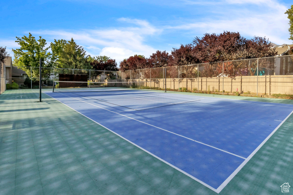 View of tennis court with community basketball court
