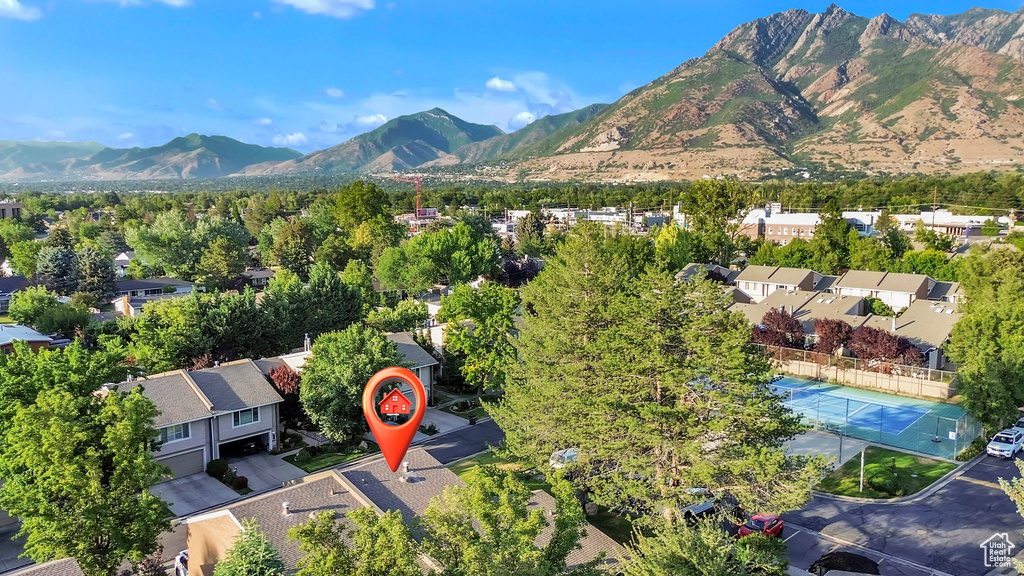 Aerial perspective of suburban area featuring a mountain backdrop