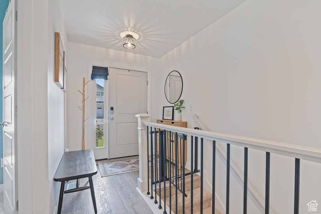 Entrance foyer with light wood-style flooring