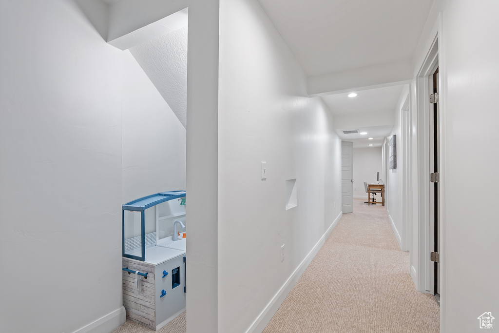 Hall featuring carpet flooring and recessed lighting