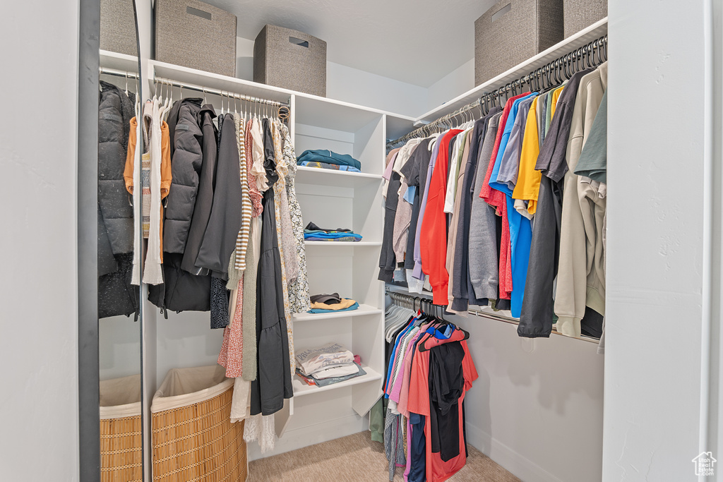 Walk in closet with carpet