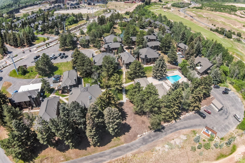 View of property location with a pool and a golf club
