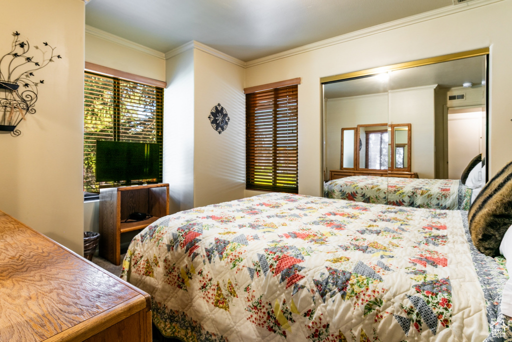Bedroom with ornamental molding