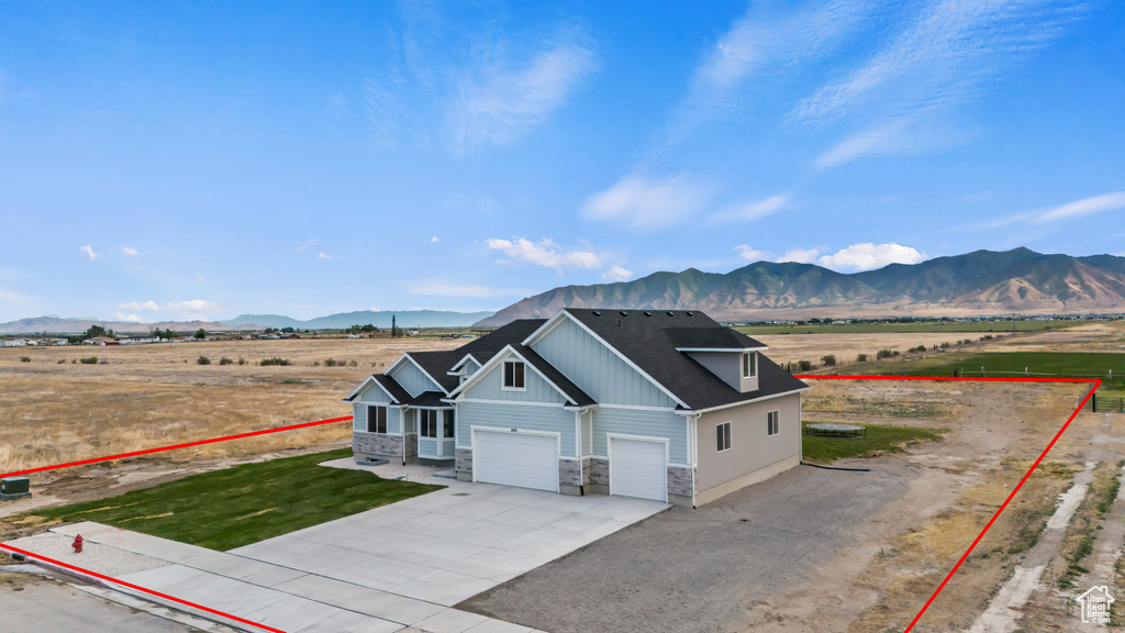 Overview of rural landscape featuring mountains and property parcel outlined