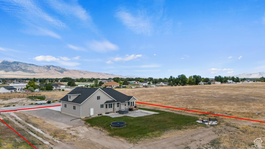 View from above of property with a mountainous background and property boundaries highlighted