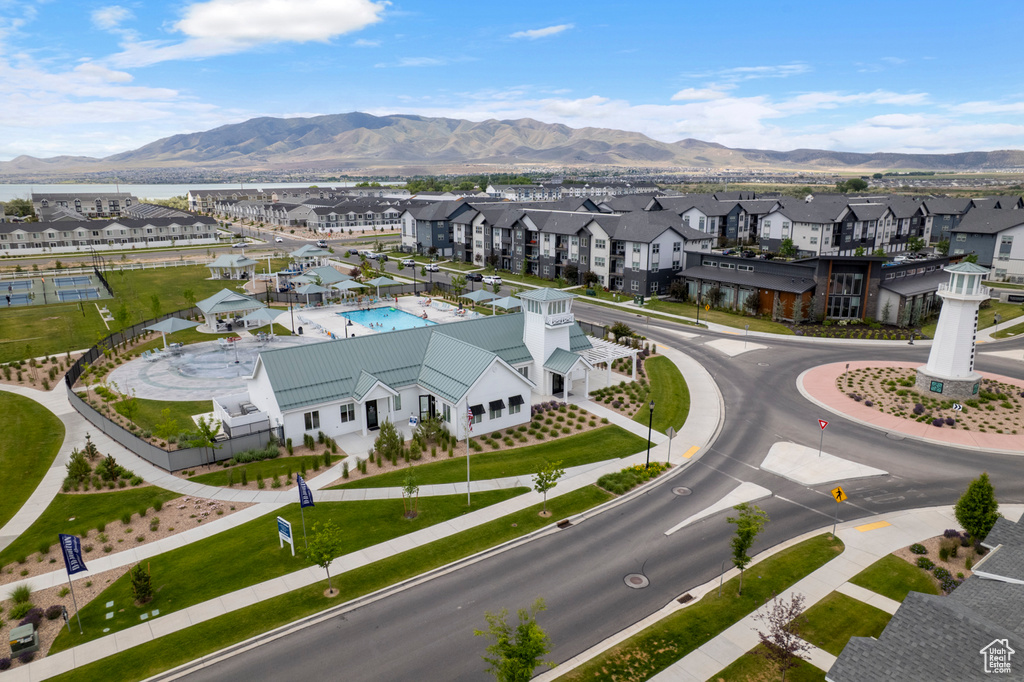 Aerial view of residential area with a water and mountain view and a pool