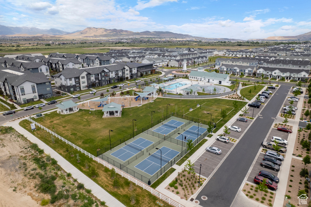 Aerial perspective of suburban area featuring a mountainous background