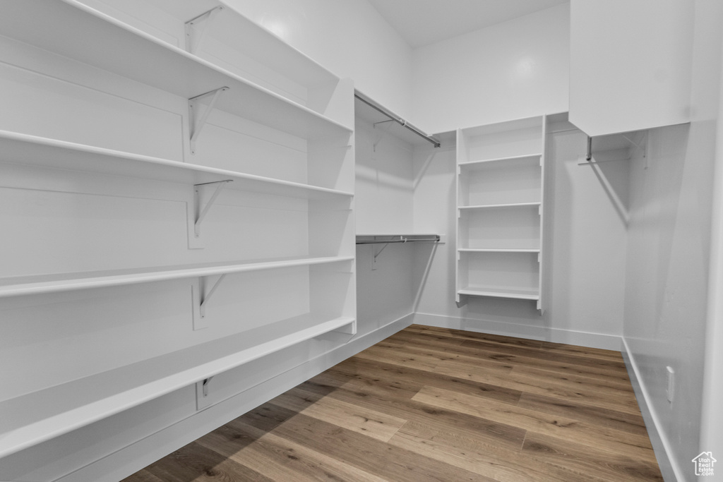 Spacious closet with wood finished floors