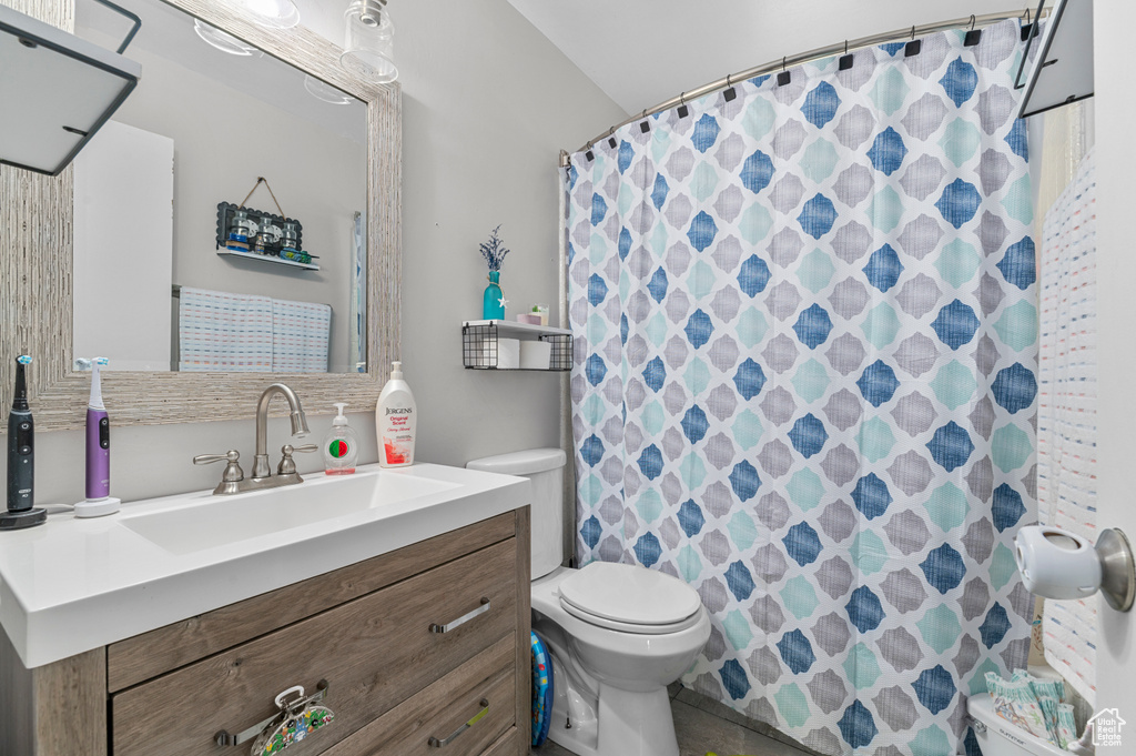 Bathroom with vanity and a shower with shower curtain