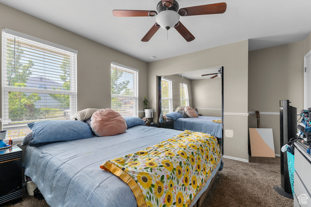 Bedroom with carpet and a ceiling fan