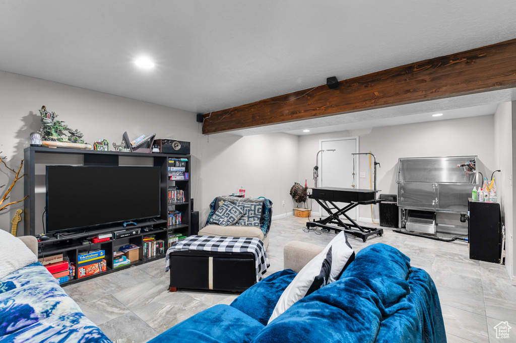 Living area featuring recessed lighting and beam ceiling