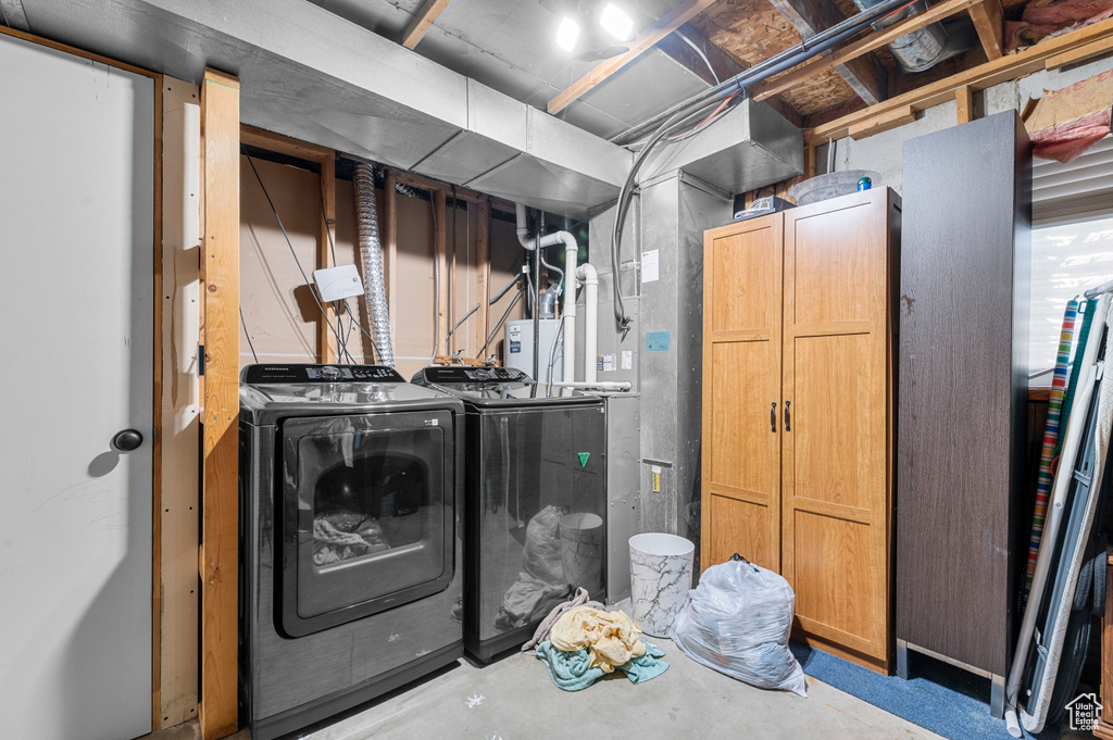 Unfinished basement with washing machine and dryer
