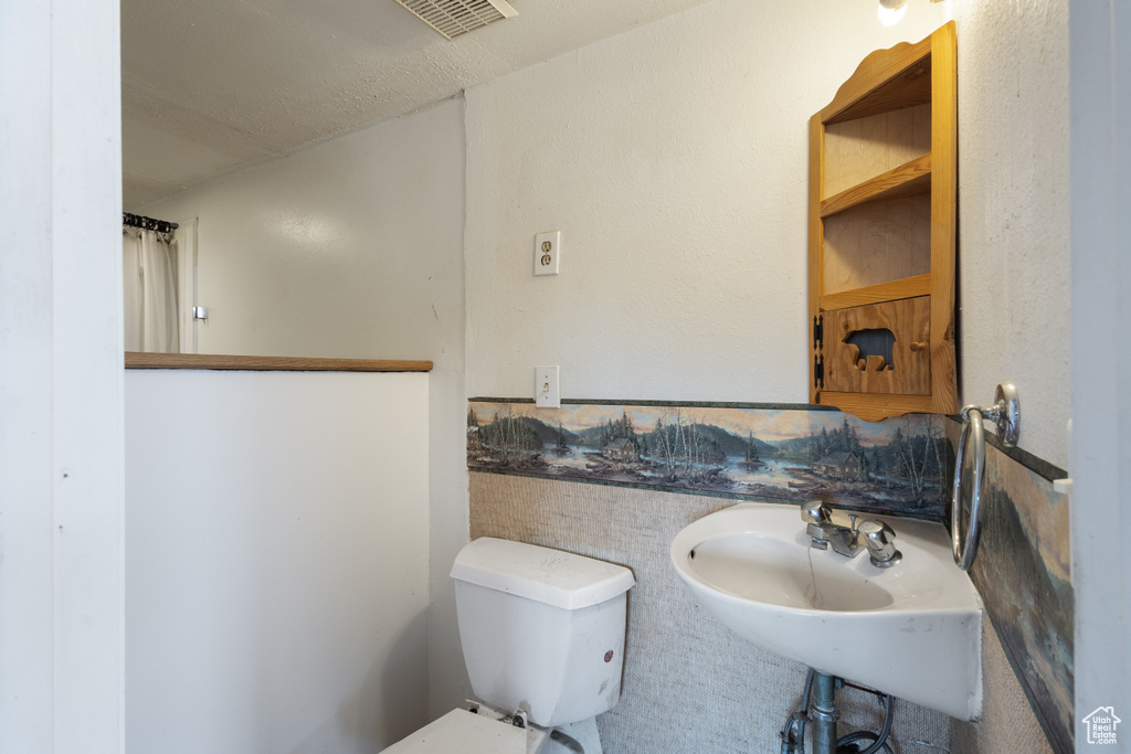 Bathroom with toilet and a sink