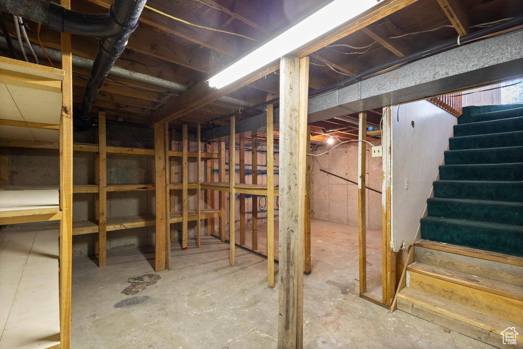 Unfinished basement featuring stairway