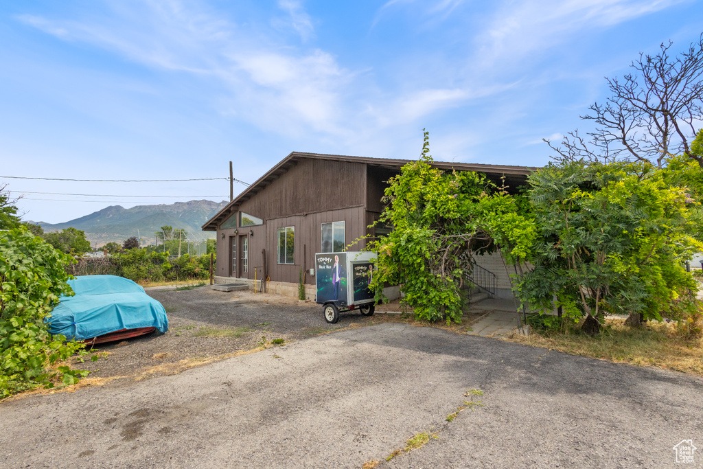 View of property exterior featuring a mountain view