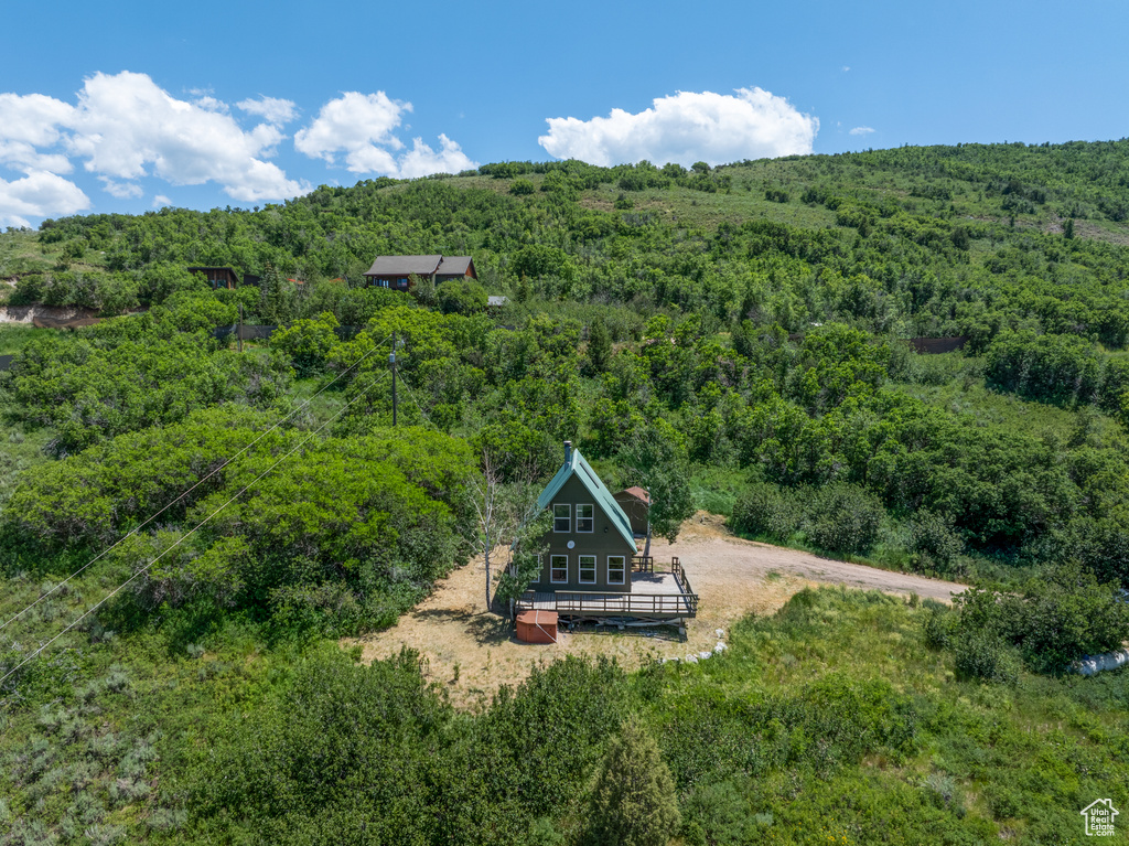 View from above of property with a forest