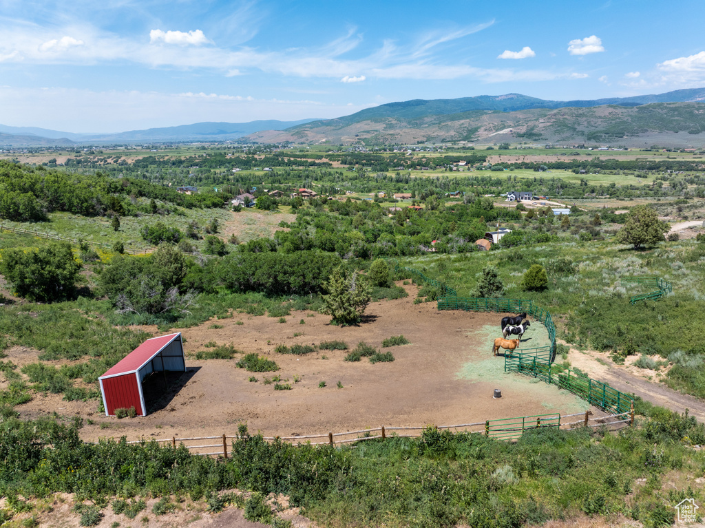 Aerial view of sparsely populated area featuring a mountainous background