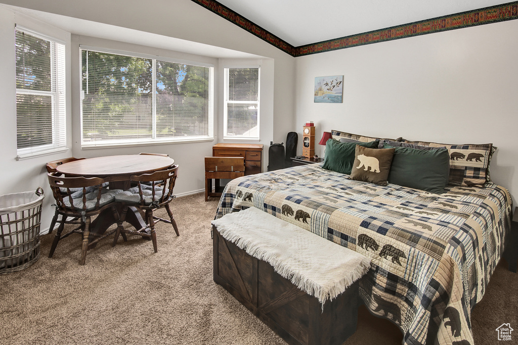 Bedroom featuring light carpet