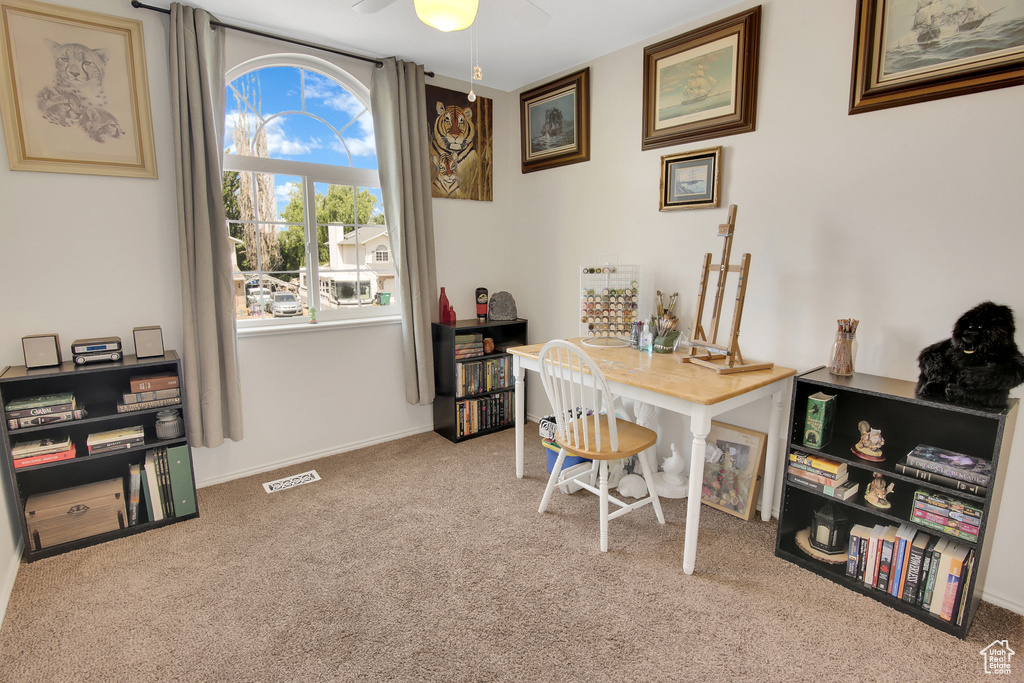 Office area featuring carpet flooring and a ceiling fan