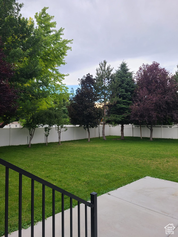 Fenced backyard with a patio