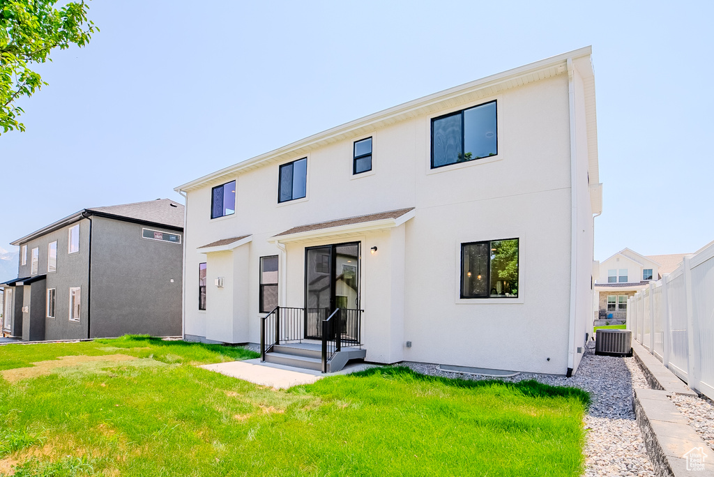 Rear view of house featuring stucco siding